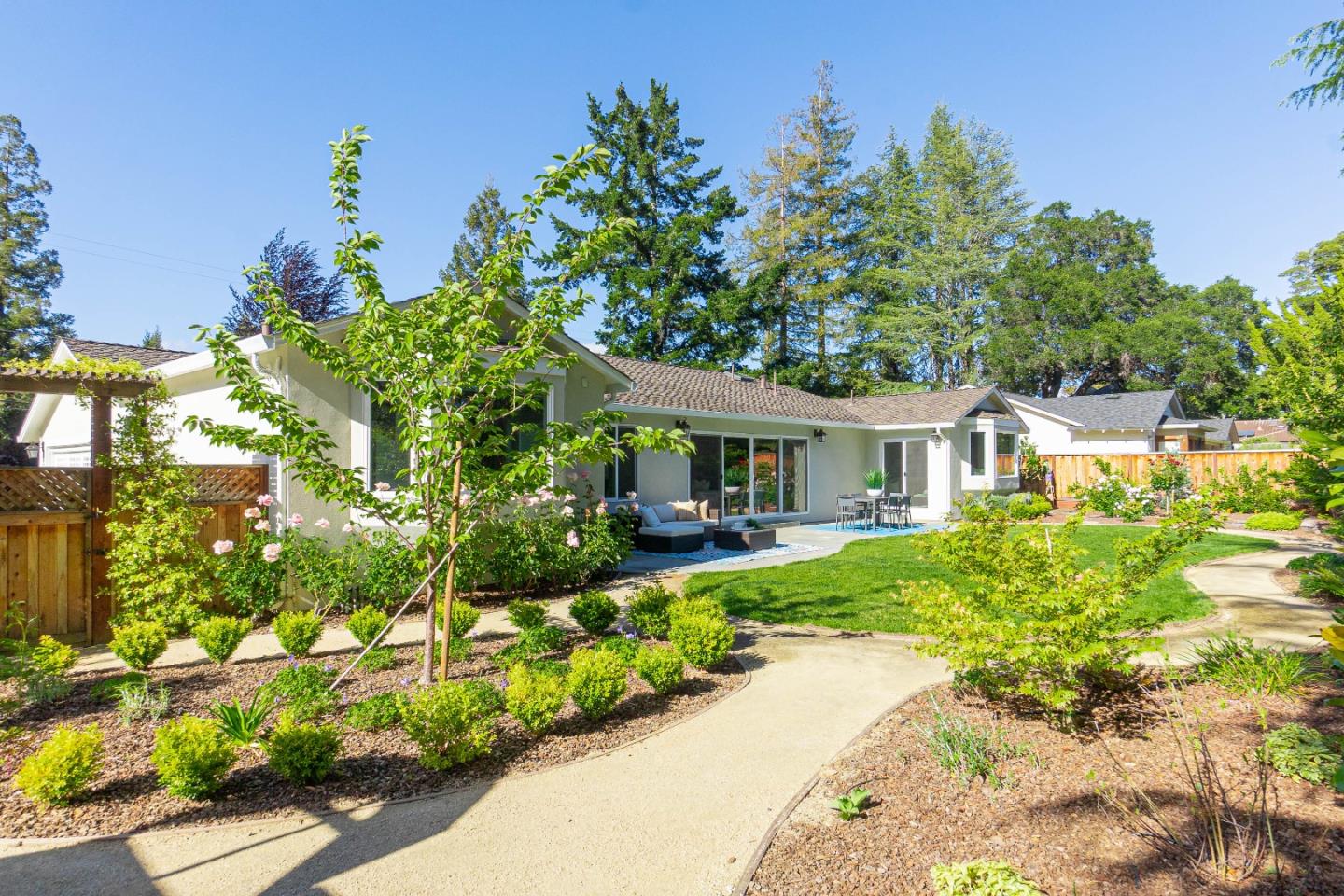 928 Manor Way Los Altos, CA 94024 - Photo 40 of 41 a front view of a house with a garden