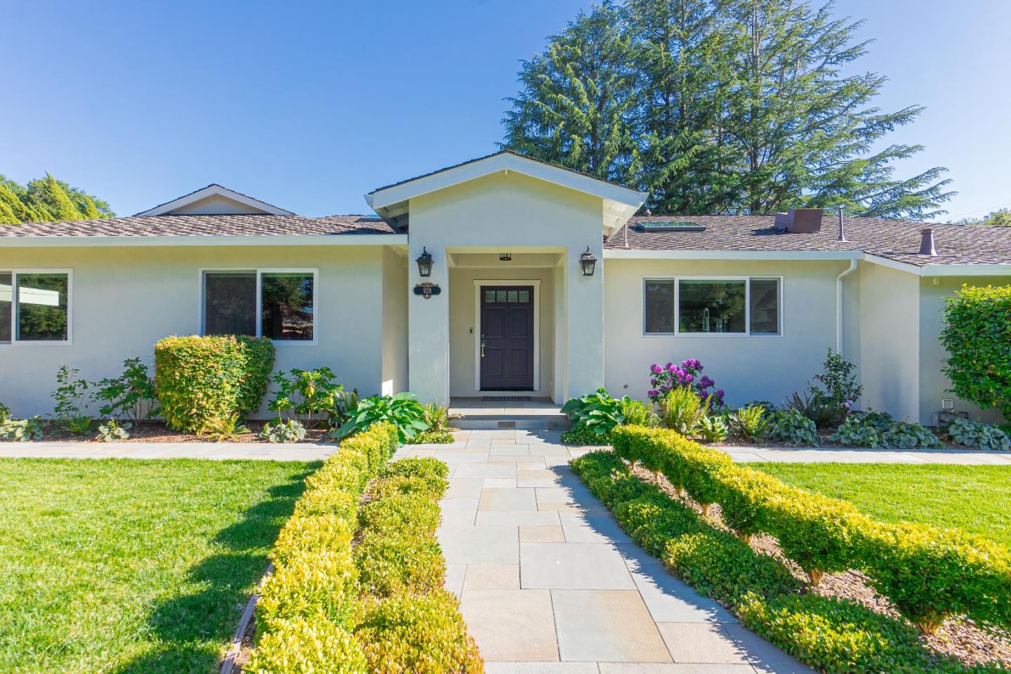 928 Manor Way Los Altos, CA 94024 - Photo 4 of 41 a front view of a house with garden