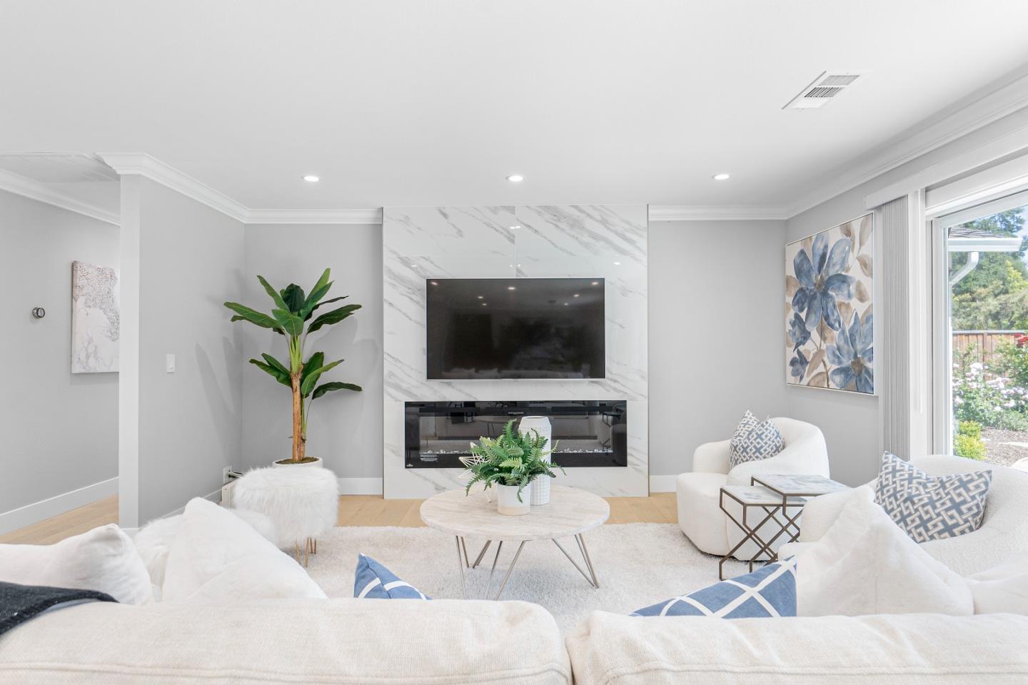 928 Manor Way Los Altos, CA 94024 - Photo 8 of 41 a living room with furniture potted plant and a window
