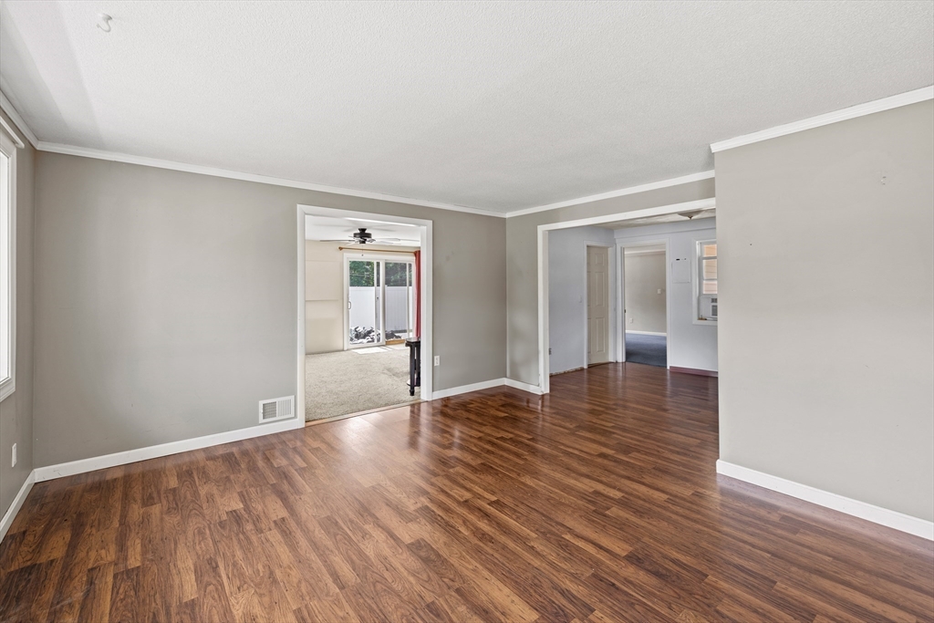 13 Naushon Road West Wareham, MA 02576 - Photo 4 of 29 a view of an empty room with wooden floor and a window