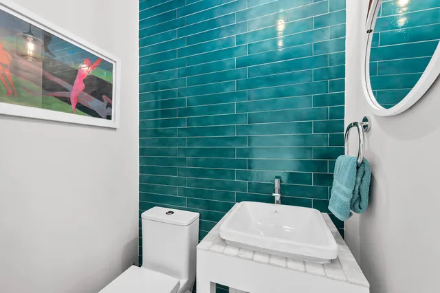 a bathroom with a toilet and a sink