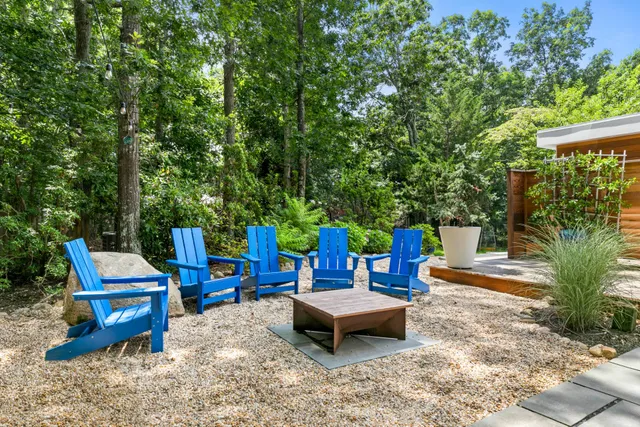 a park view with a bench in a backyard