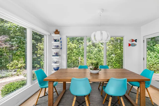 a view of a dining room with furniture and window