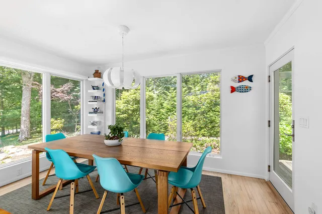 a view of a dining room with furniture window and outside view