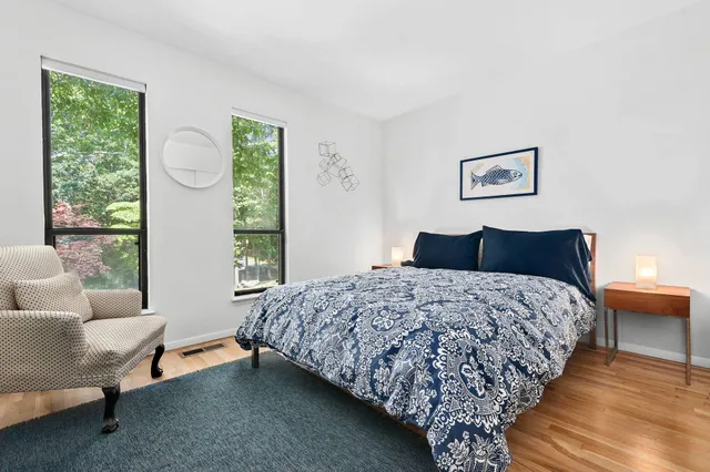 a bedroom with bed and window