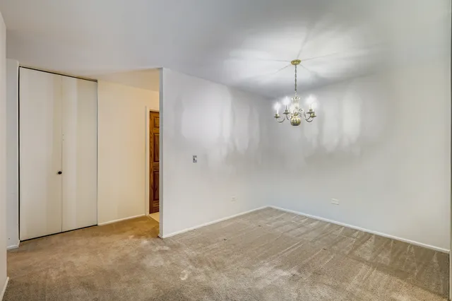 a view of a chandelier fan in a room