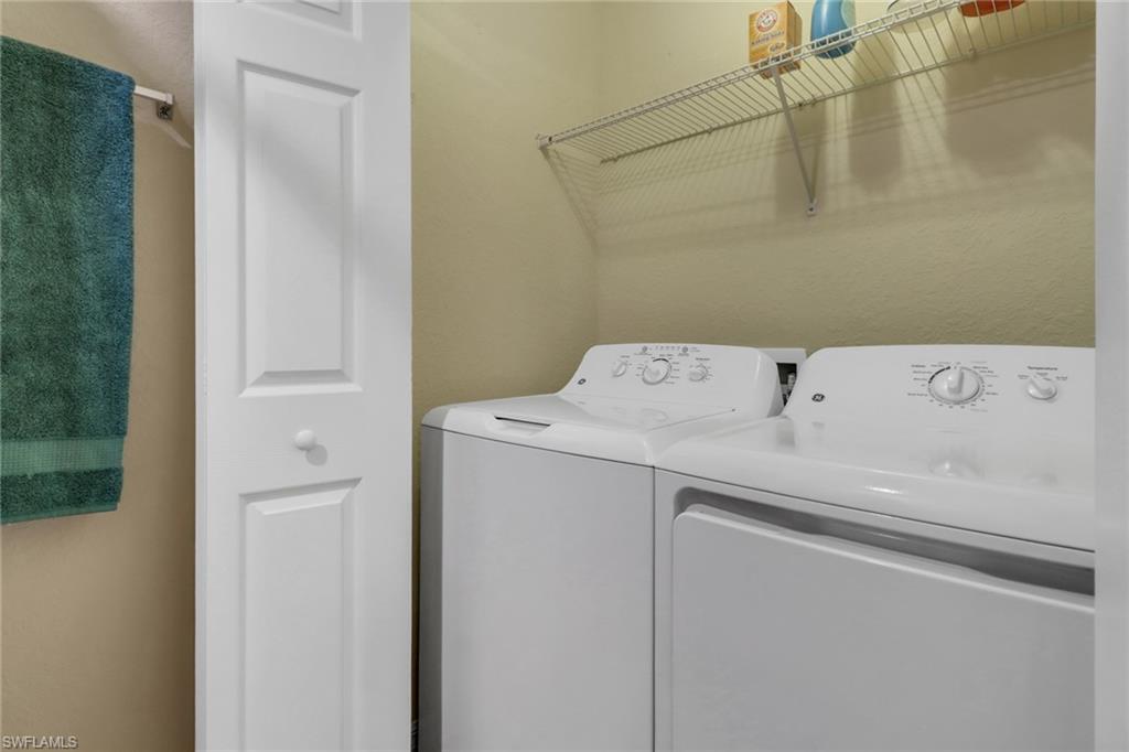 9560 Trevi Court, Unit 4814 Naples, FL 34113 - Photo 20 of 42 a utility room with dryer and washer