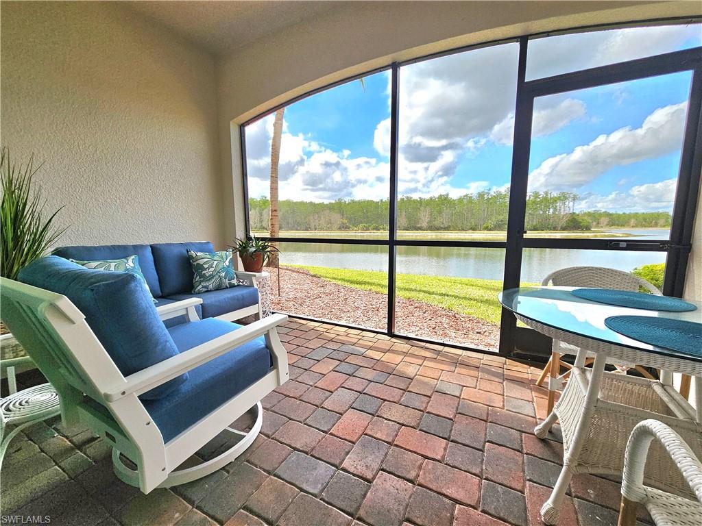 9560 Trevi Court, Unit 4814 Naples, FL 34113 - Photo 21 of 42 a living room with a large window