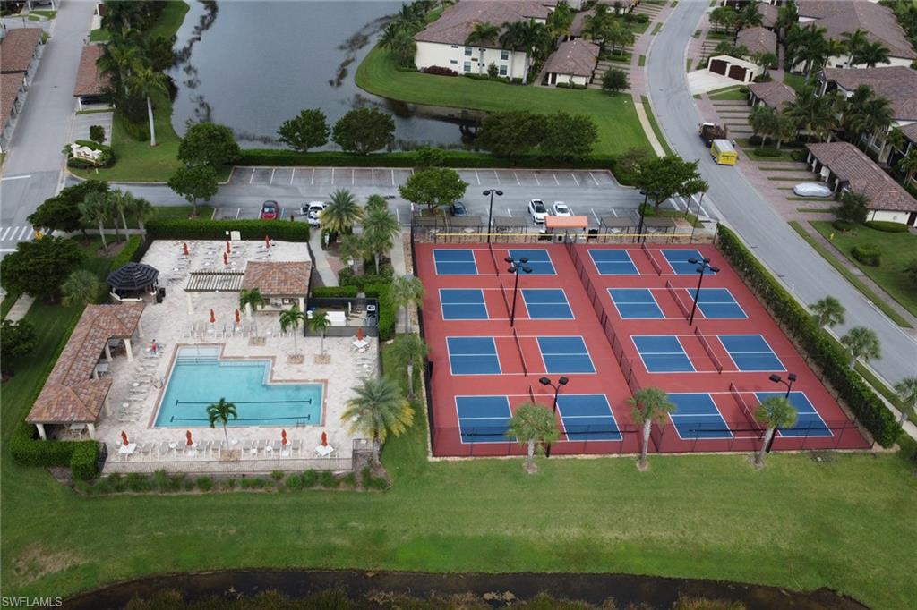 9560 Trevi Court, Unit 4814 Naples, FL 34113 - Photo 23 of 42 an aerial view of multiple houses