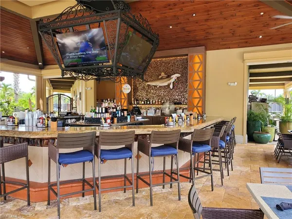 a view of a chairs and table in a patio