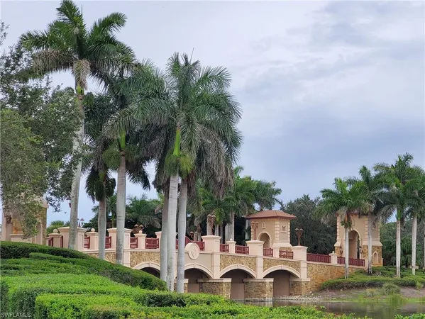 a view of a house with garden and trees