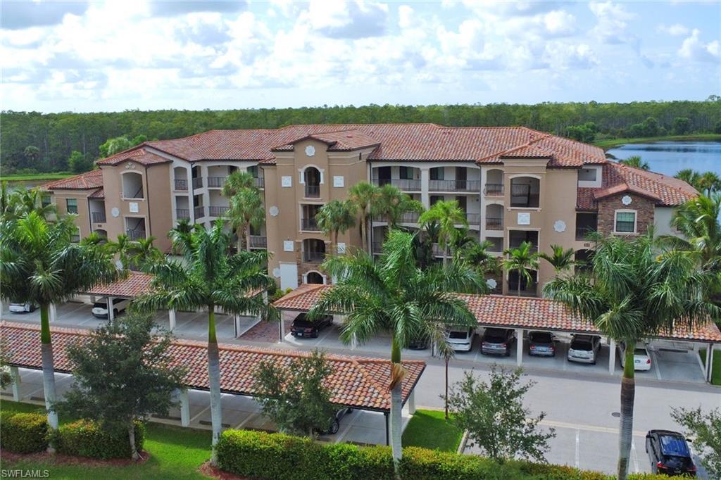 9560 Trevi Court, Unit 4814 Naples, FL 34113 - Photo 5 of 42 a view of a yard in front of house