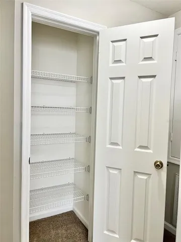 a view of a room with rack on the wall