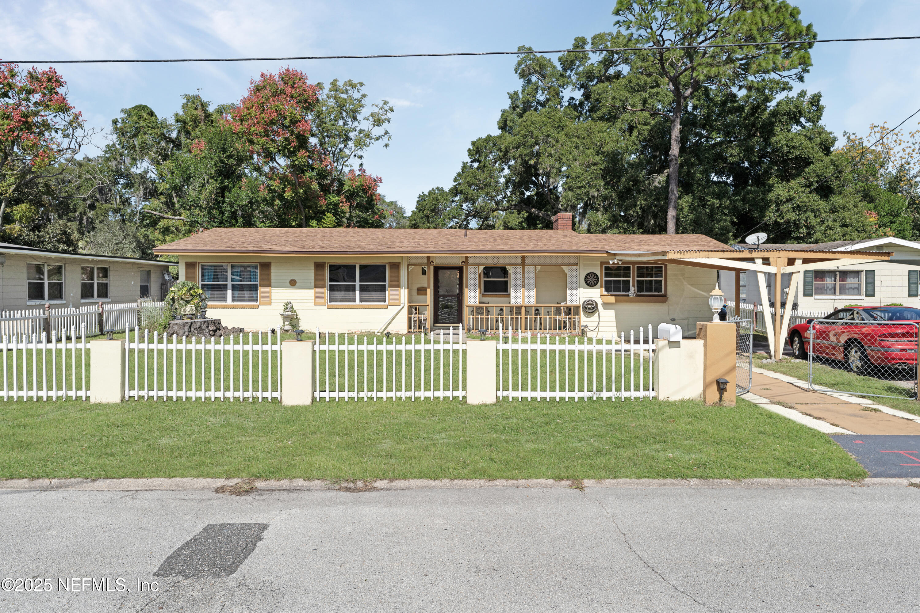 5845 Ransom Street Jacksonville, FL 32211 - Photo 1 of 23 front view of a house with a garden
