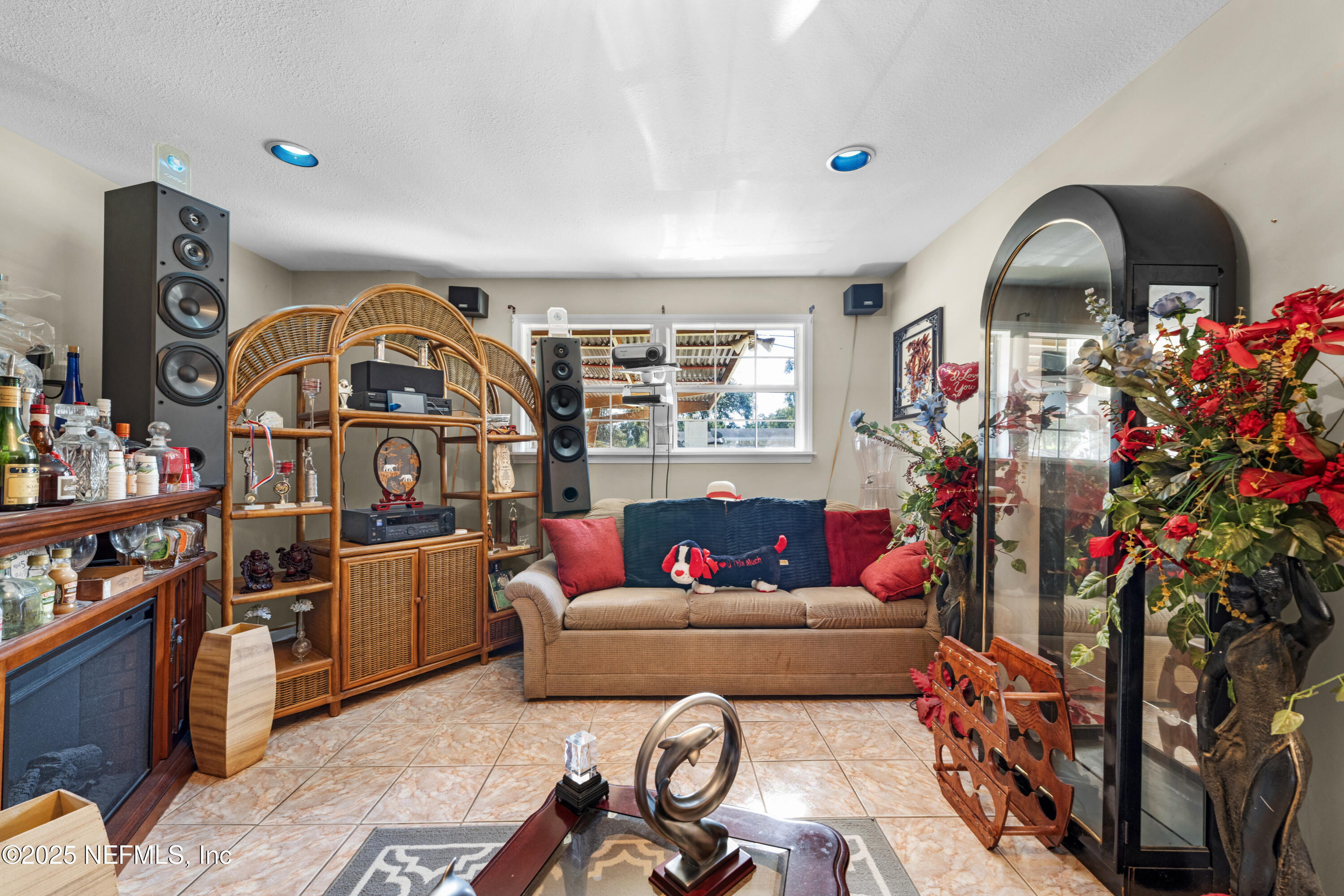 5845 Ransom Street Jacksonville, FL 32211 - Photo 11 of 23 a living room with furniture a rug and a chandelier