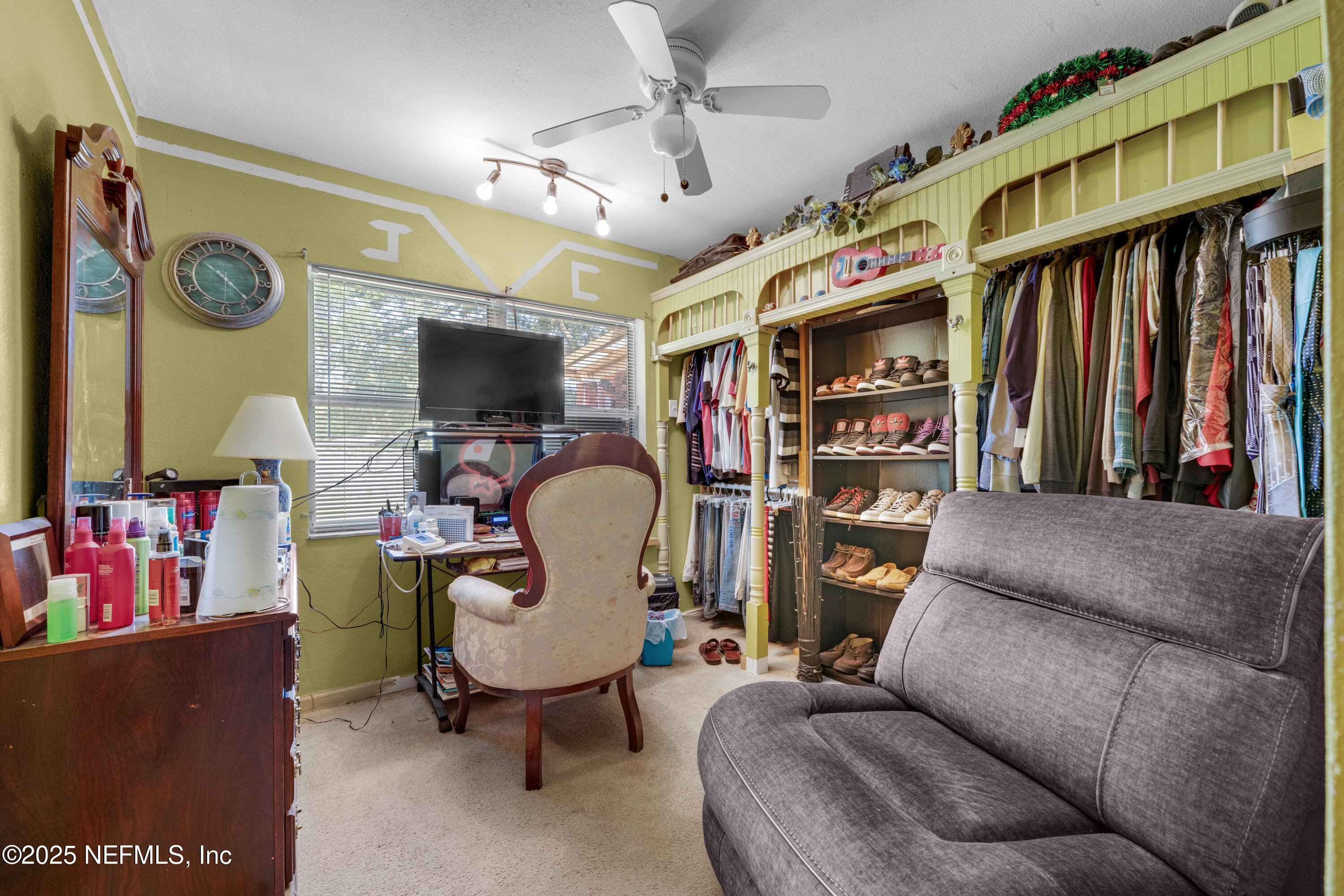 5845 Ransom Street Jacksonville, FL 32211 - Photo 20 of 23 a living room with lots of furniture and a flat screen tv