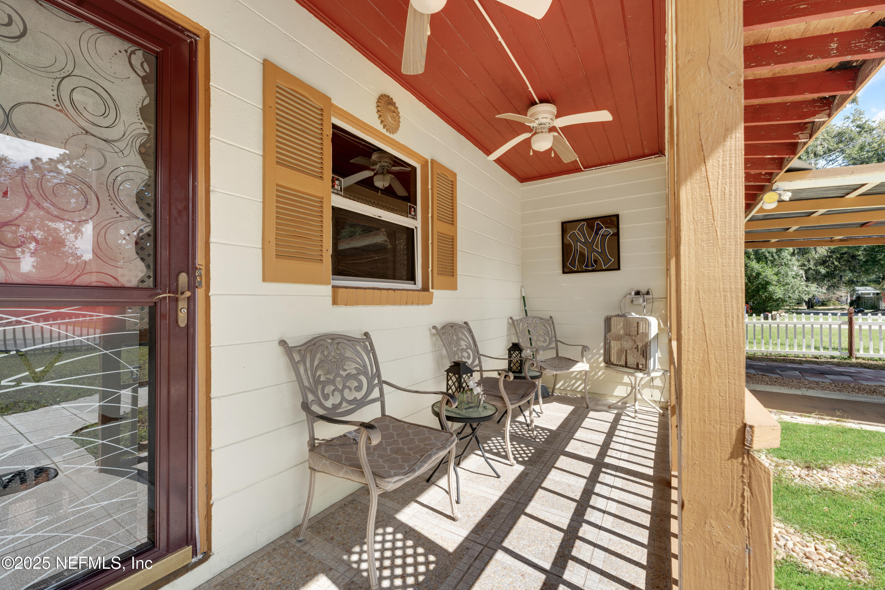 5845 Ransom Street Jacksonville, FL 32211 - Photo 4 of 23 a outdoor space with patio the couches and a potted plant on a table with wooden floor