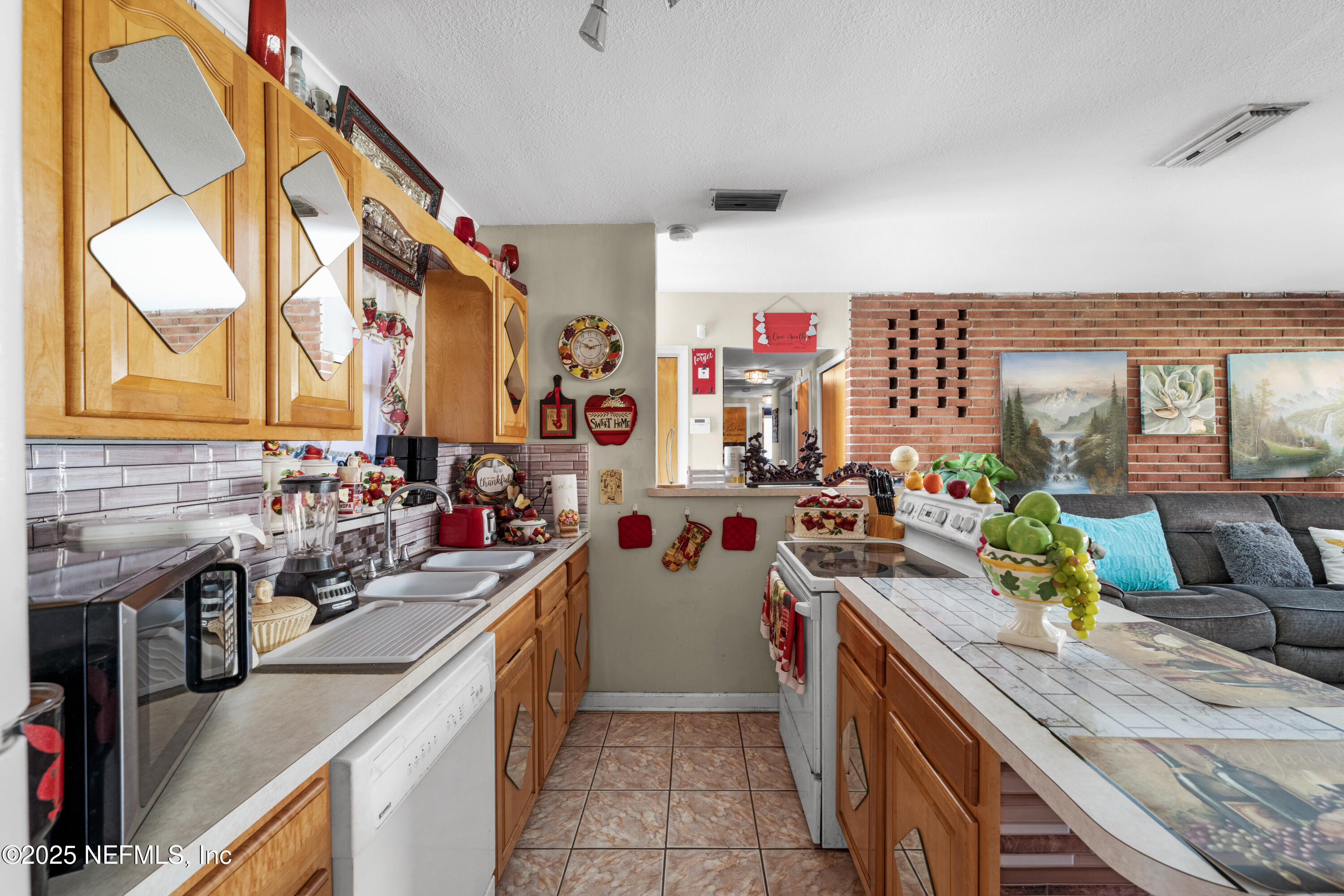 5845 Ransom Street Jacksonville, FL 32211 - Photo 8 of 23 a kitchen with a sink stove and cabinets