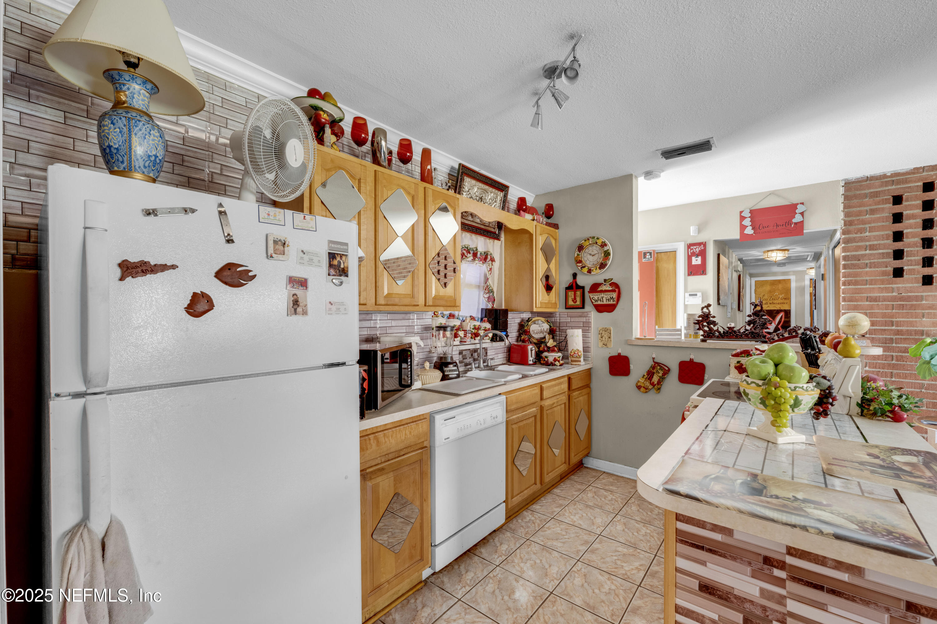 5845 Ransom Street Jacksonville, FL 32211 - Photo 9 of 23 a kitchen with stainless steel appliances granite countertop a refrigerator and a stove