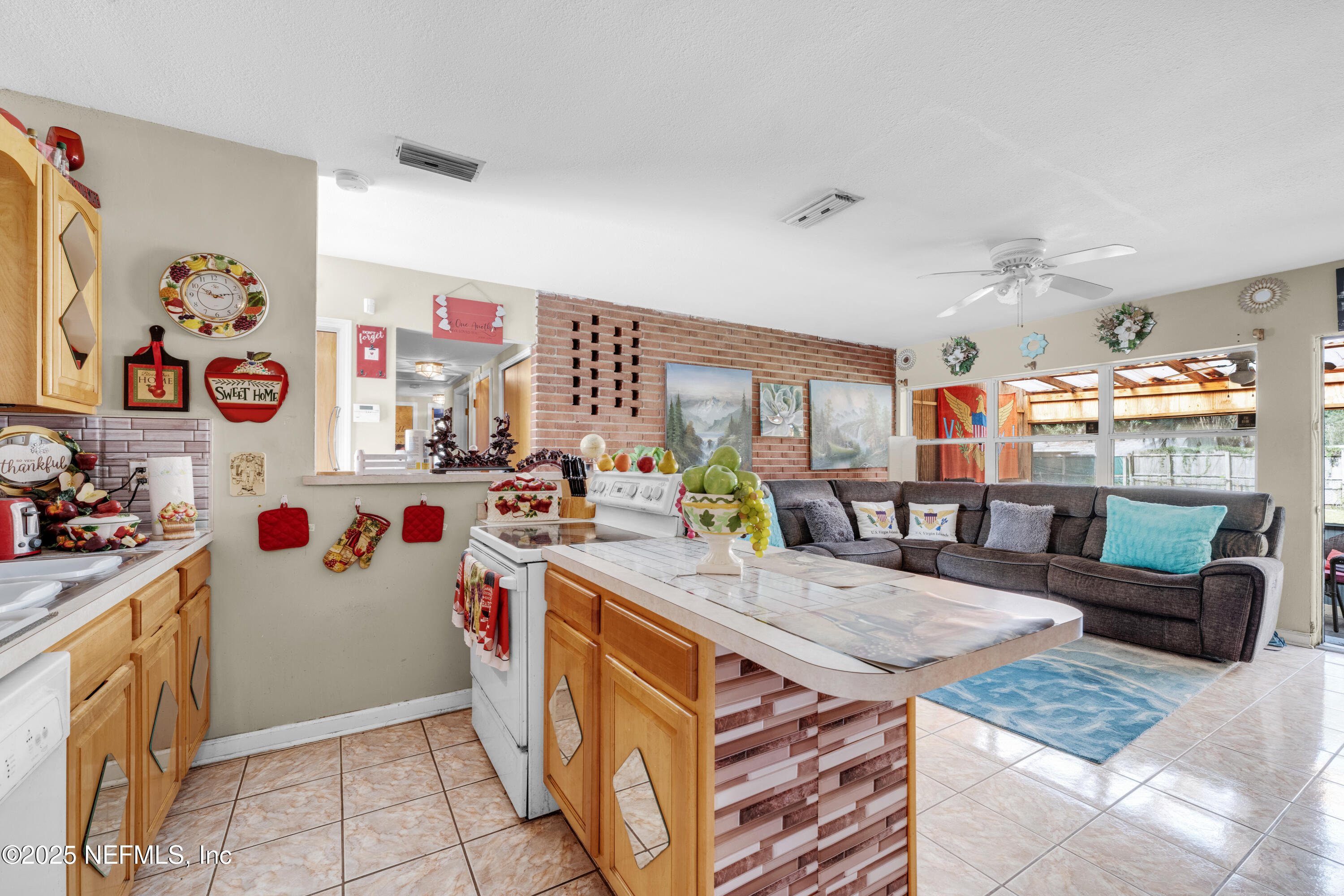 5845 Ransom Street Jacksonville, FL 32211 - Photo 10 of 23 a kitchen with stainless steel appliances granite countertop a stove and cabinets