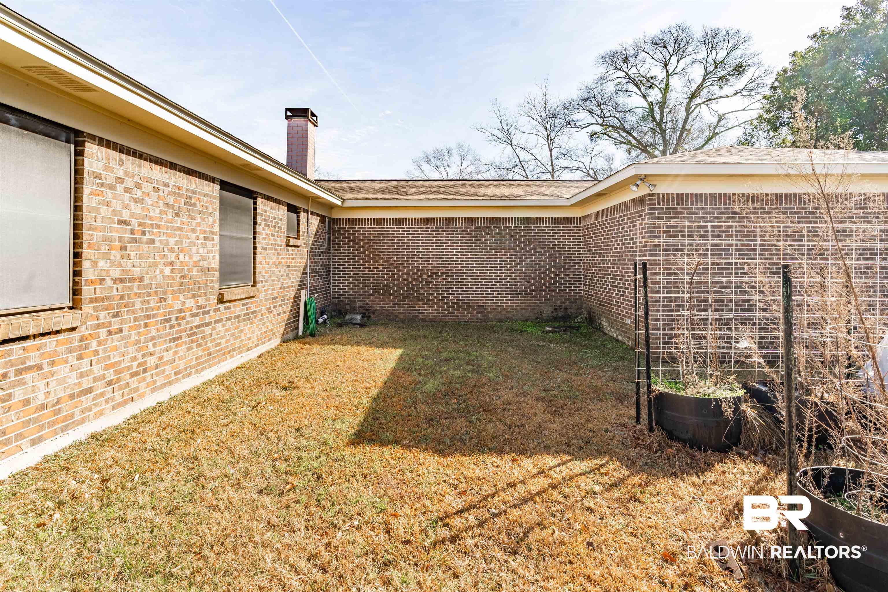 9751 Pine Knoll Road Mobile, AL 36608 - Photo 31 of 36 View of green lawn