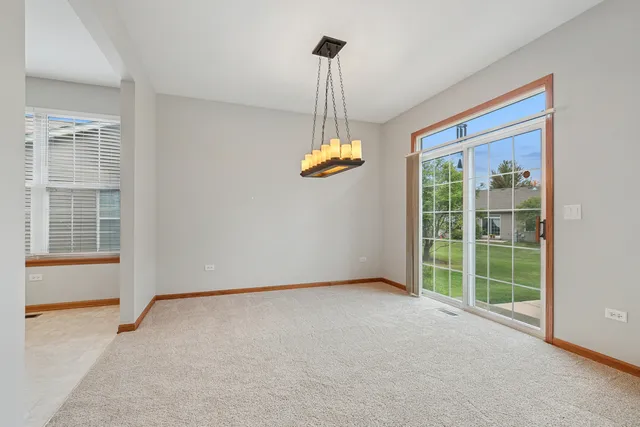 a view of empty room with floor to ceiling window