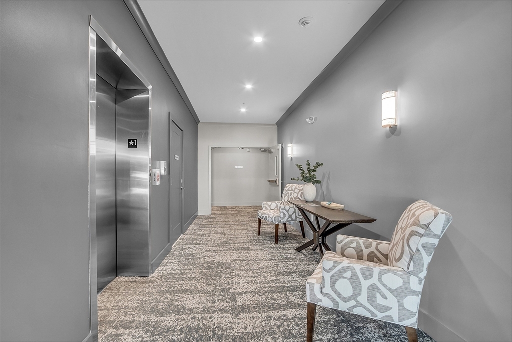 55 Pointe Place, Unit 206 Dover, NH 03820 - Photo 36 of 41 a view of a livingroom with furniture and wooden floor