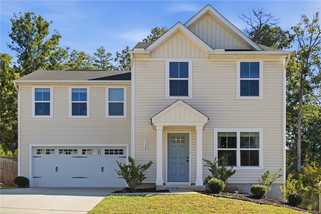 112 Wls Sta Road Seneca, SC 29678 - Photo 1 of 42 A classic two-story exterior showcases neat siding, a welcoming entryway portico, and an integrated garage.