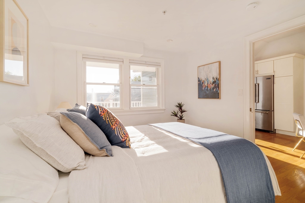 59 Berkeley Street, Unit 3 Somerville, MA 02143 - Photo 12 of 18 a bedroom with a bed and a window