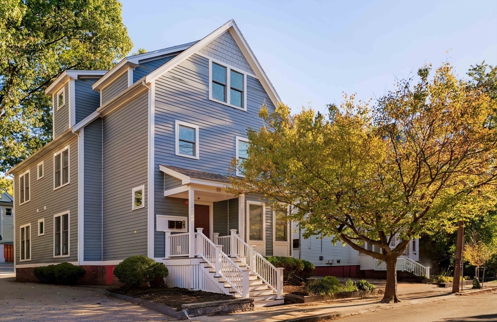 59 Berkeley Street, Unit 3 Somerville, MA 02143 - Photo 18 of 18 a front view of a building with trees