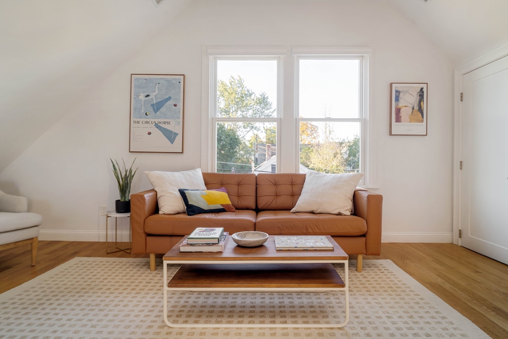 59 Berkeley Street, Unit 3 Somerville, MA 02143 - Photo 4 of 18 a living room with furniture and a rug