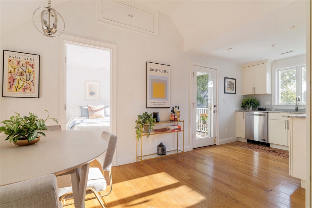59 Berkeley Street, Unit 3 Somerville, MA 02143 - Photo 8 of 18 a living room with furniture and a kitchen