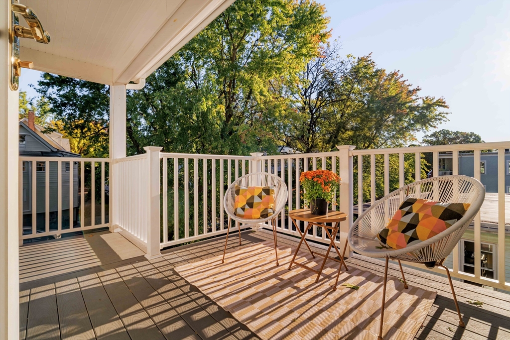 59 Berkeley Street, Unit 3 Somerville, MA 02143 - Photo 9 of 18 a balcony with wooden floor barbeque oven and outdoor seating