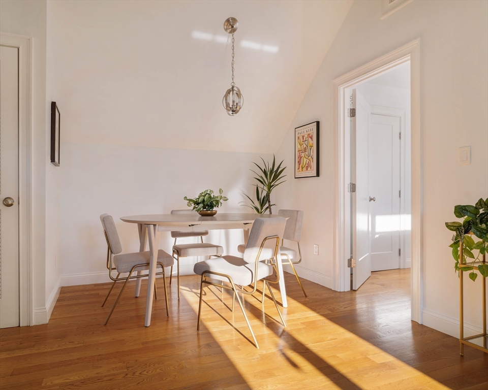 59 Berkeley Street, Unit 3 Somerville, MA 02143 - Photo 10 of 18 a view of a dining room with furniture and wooden floor