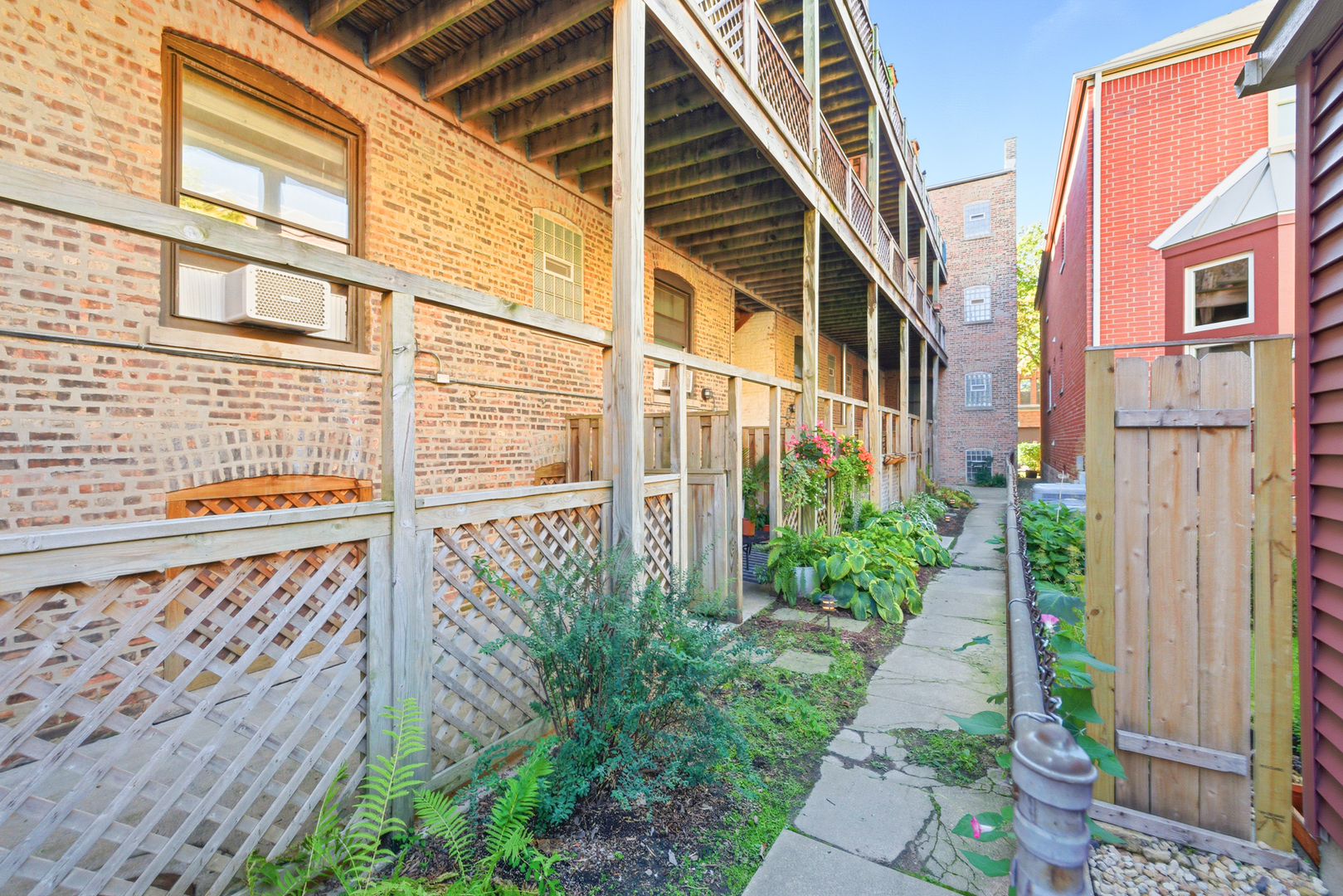 1014 West Barry Avenue, Unit 1 Chicago, IL 60657 - Photo 14 of 17 a view of a brick house with many windows
