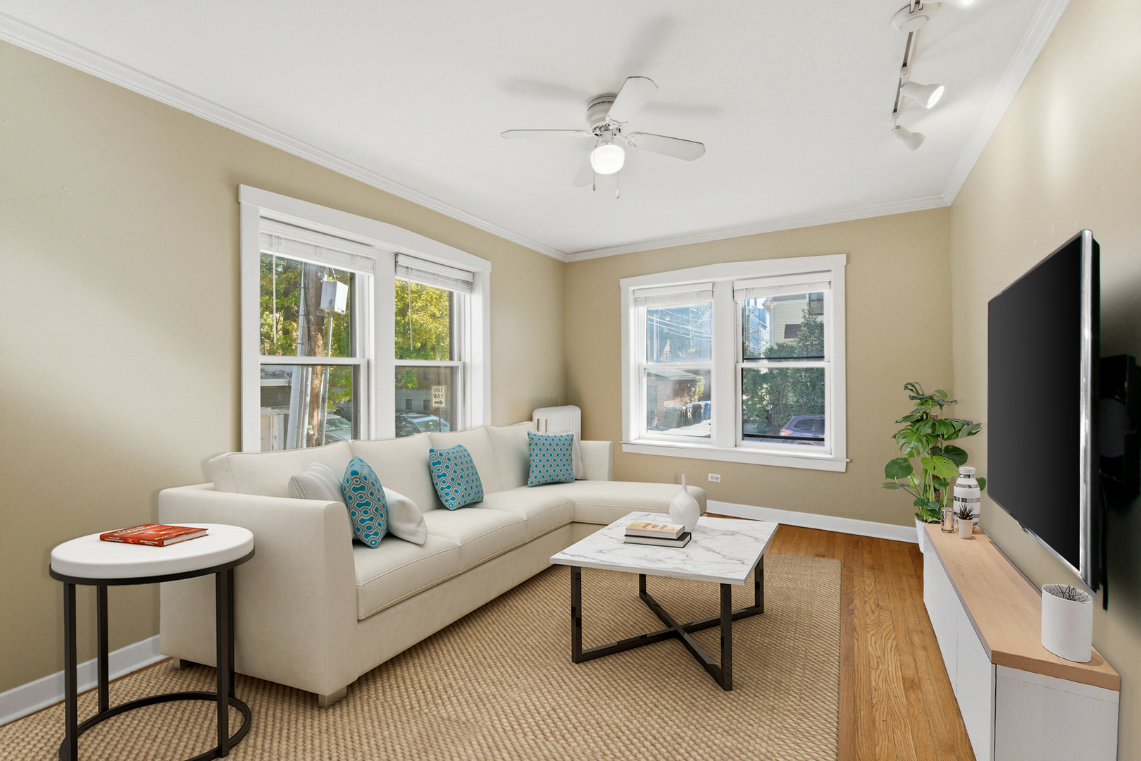 1014 West Barry Avenue, Unit 1 Chicago, IL 60657 - Photo 2 of 17 a living room with furniture and a flat screen tv