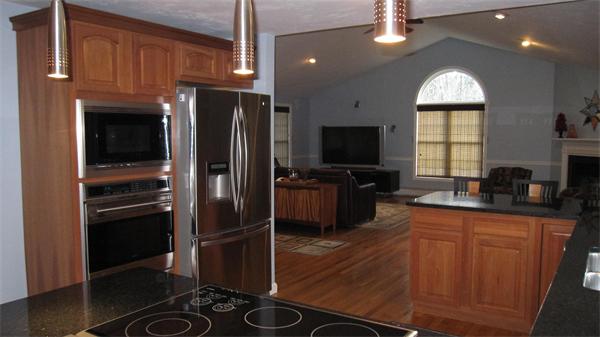 7 Sidney Road Sturbridge, MA 01566 - Photo 8 of 30 a kitchen with granite countertop a refrigerator stove and microwave