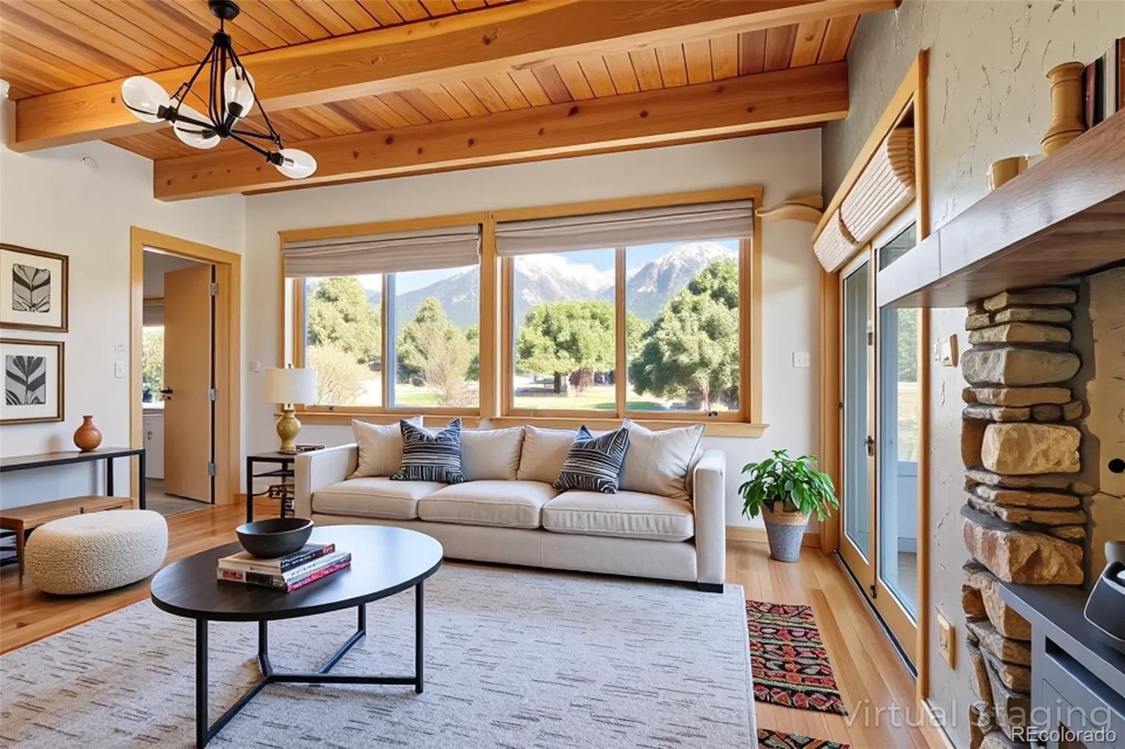 1507 Wagon Wheel Road Crestone, CO 81131 - Photo 13 of 50 a living room with furniture a rug and a large window