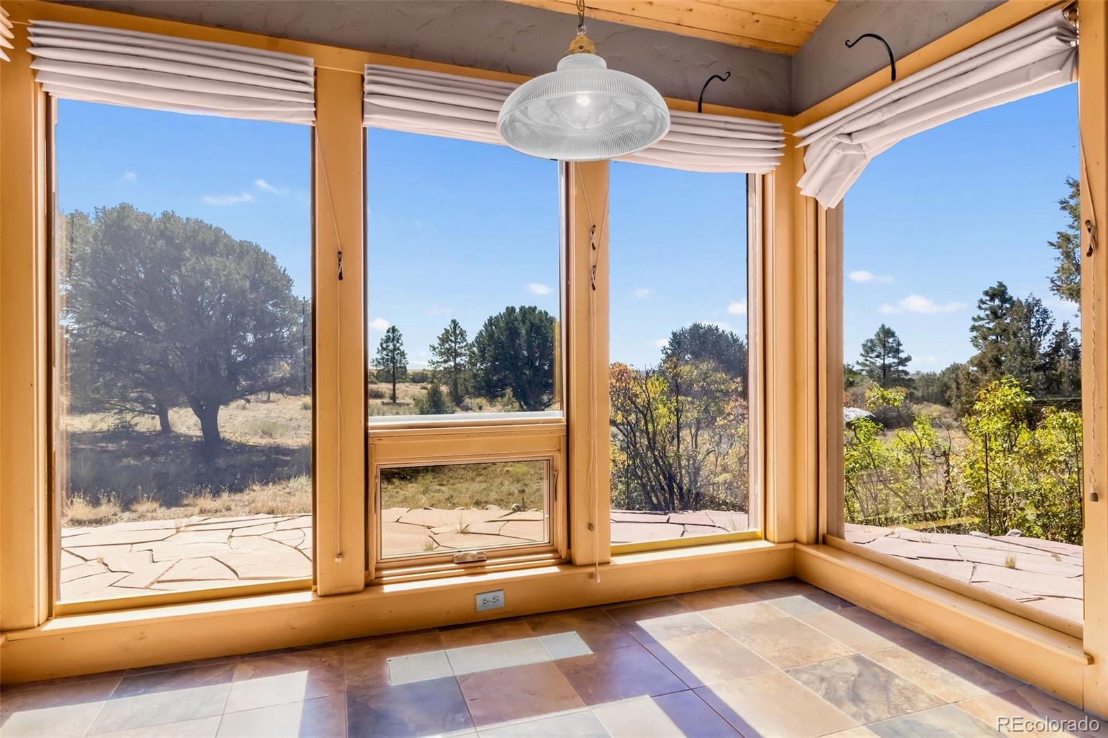 1507 Wagon Wheel Road Crestone, CO 81131 - Photo 16 of 50 a view of a room with wooden floor and a bed