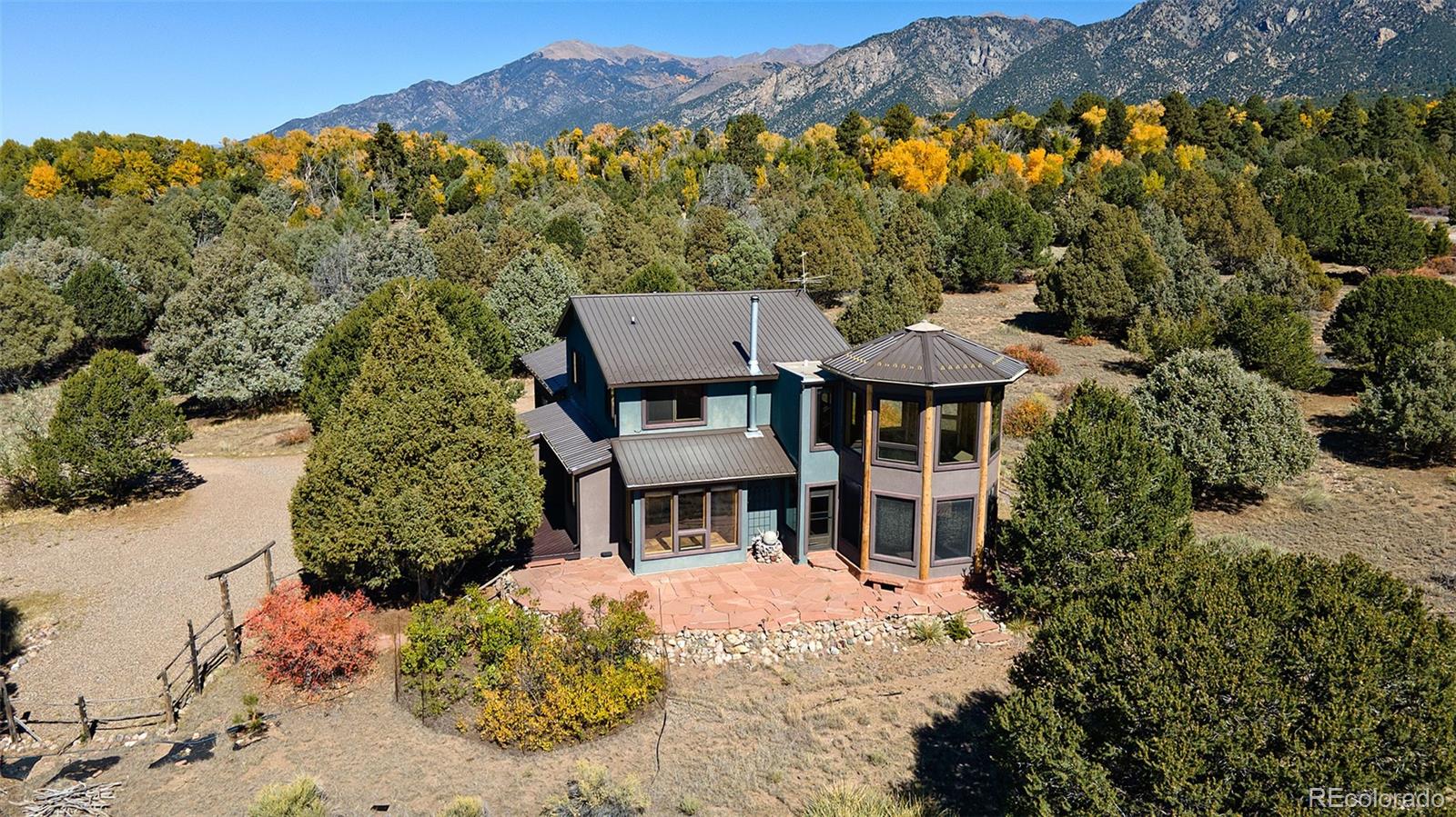 1507 Wagon Wheel Road Crestone, CO 81131 - Photo 2 of 50 a front view of a house with a yard