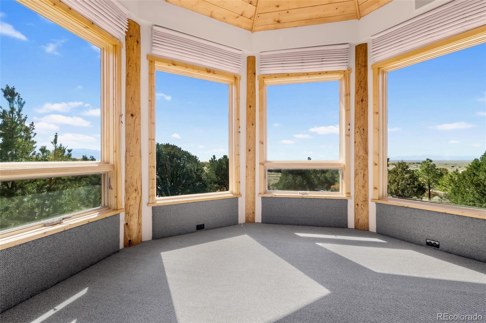 1507 Wagon Wheel Road Crestone, CO 81131 - Photo 41 of 50 a view of a glass door with a balcony