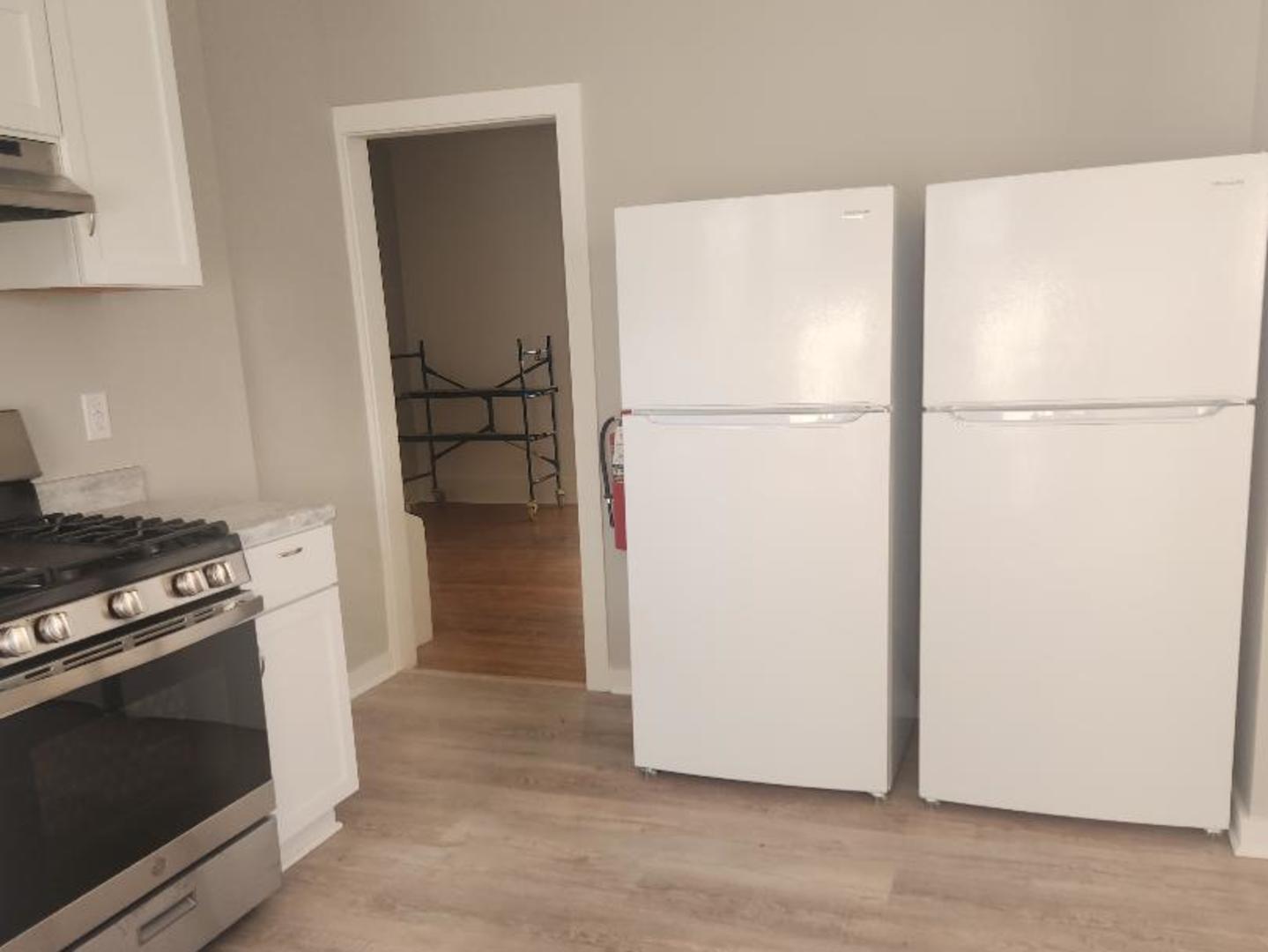 345 Augusta Avenue DeKalb, IL 60115 - Photo 19 of 25 a kitchen with a stove and a refrigerator