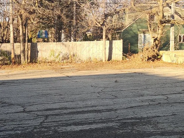 a view of a swimming pool with a yard