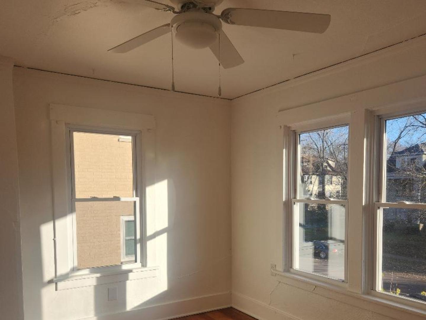 345 Augusta Avenue DeKalb, IL 60115 - Photo 8 of 25 a view of an empty room with a window