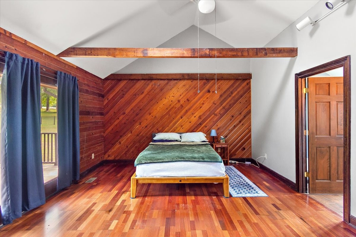 1510 Penile Hill Road Decherd, TN 37324 - Photo 15 of 34 a room with wooden floor and a chair