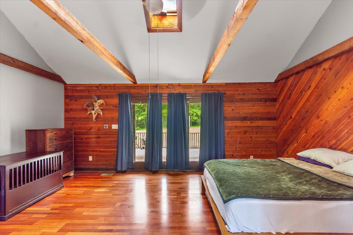 1510 Penile Hill Road Decherd, TN 37324 - Photo 16 of 34 a bedroom with a bed and wooden floor