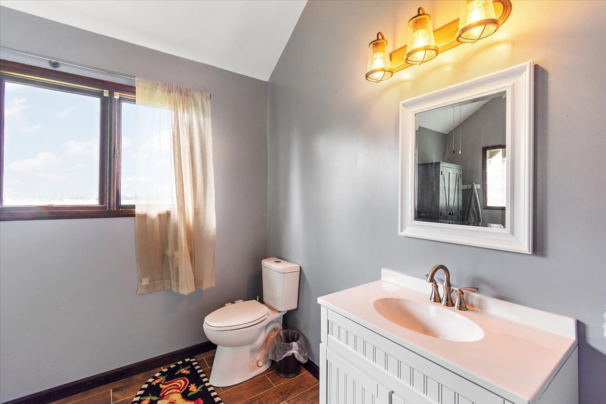 1510 Penile Hill Road Decherd, TN 37324 - Photo 18 of 34 a bathroom with a sink a toilet and a mirror