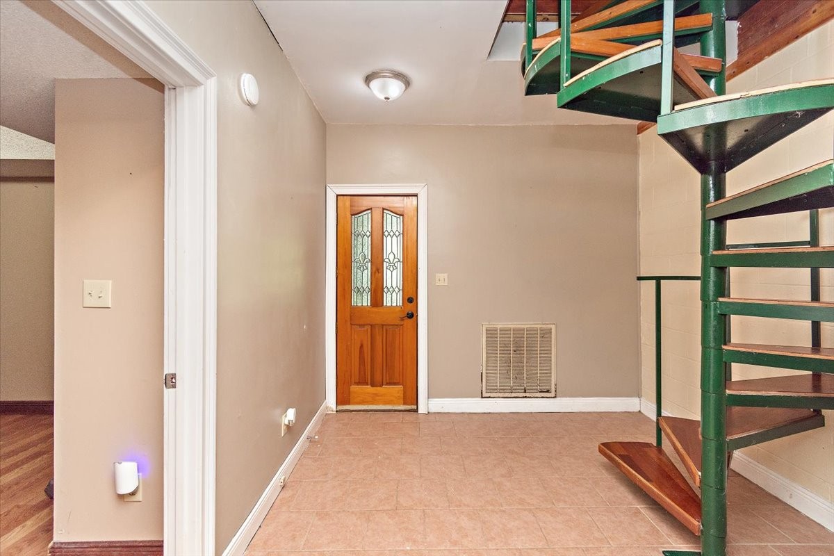 1510 Penile Hill Road Decherd, TN 37324 - Photo 21 of 34 a view of a room with wooden floor and windows