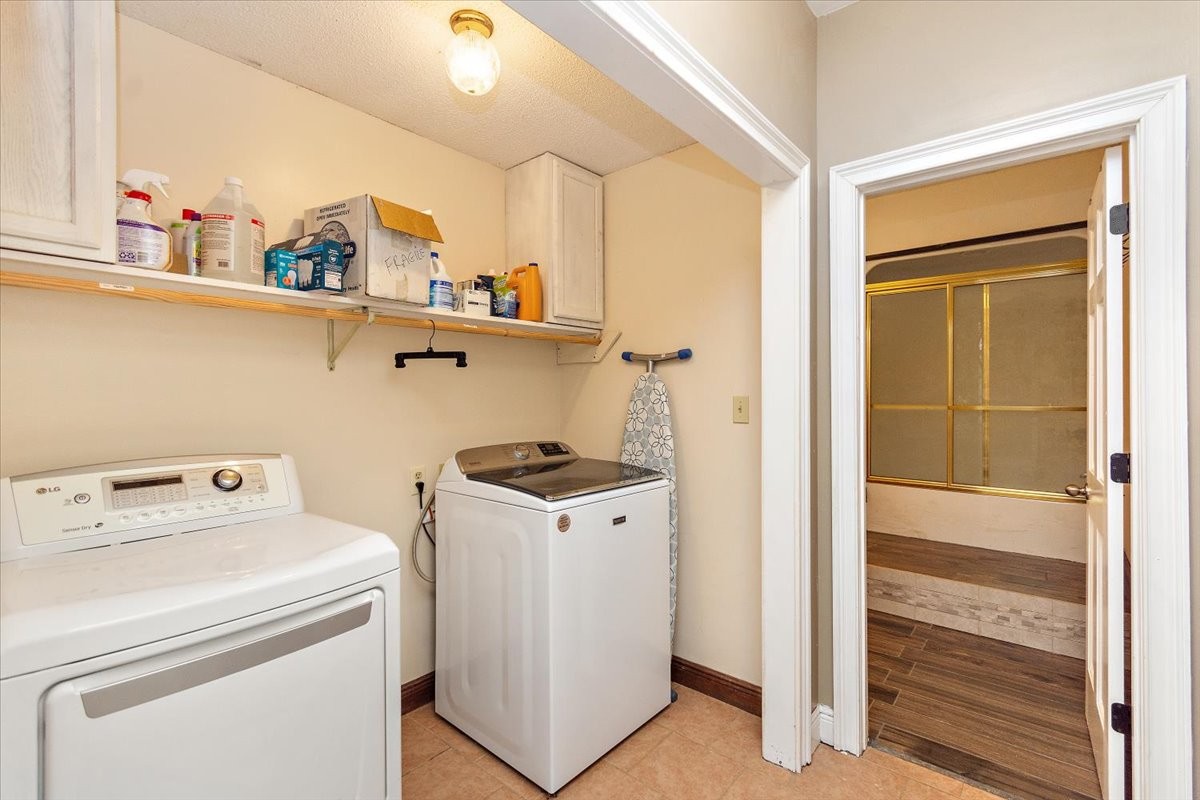 1510 Penile Hill Road Decherd, TN 37324 - Photo 24 of 34 a view of storage and utility room with washer and dryer