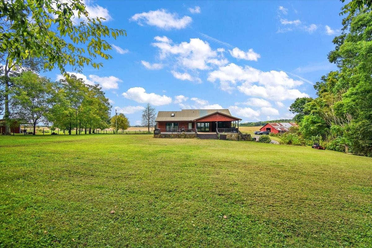 1510 Penile Hill Road Decherd, TN 37324 - Photo 29 of 34 a yellow building with trees in the background
